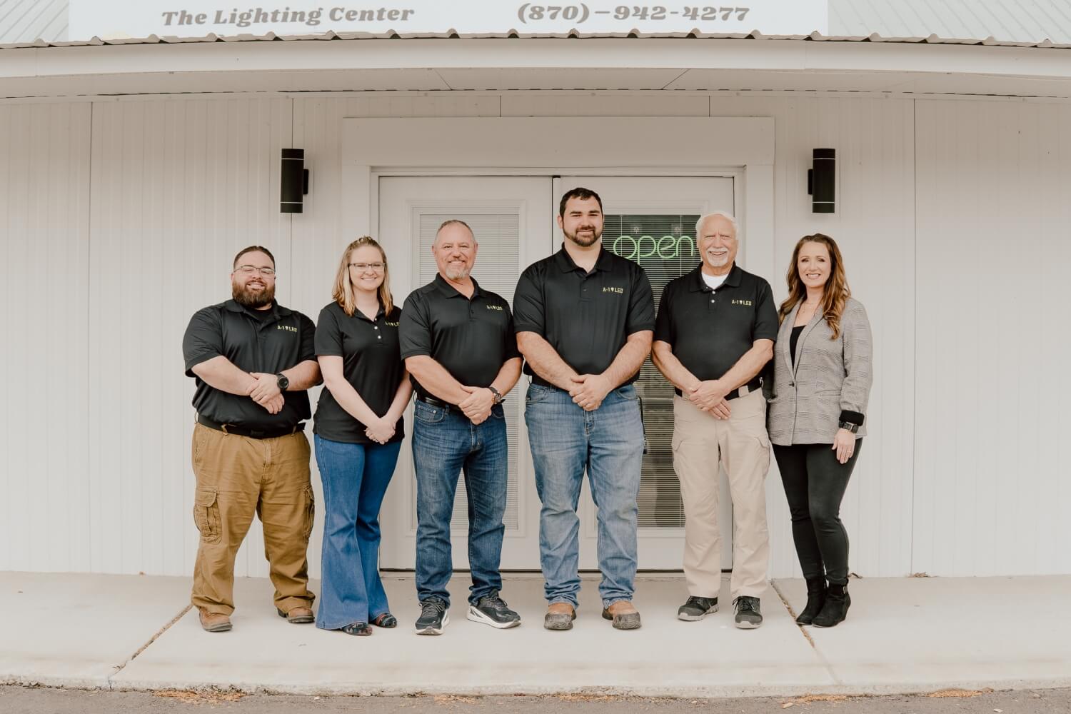 A-1 LED's executive team poses outside of our Sheridan, AR location wearing branded polos. We stand together ready to serve our local and regional customers. 