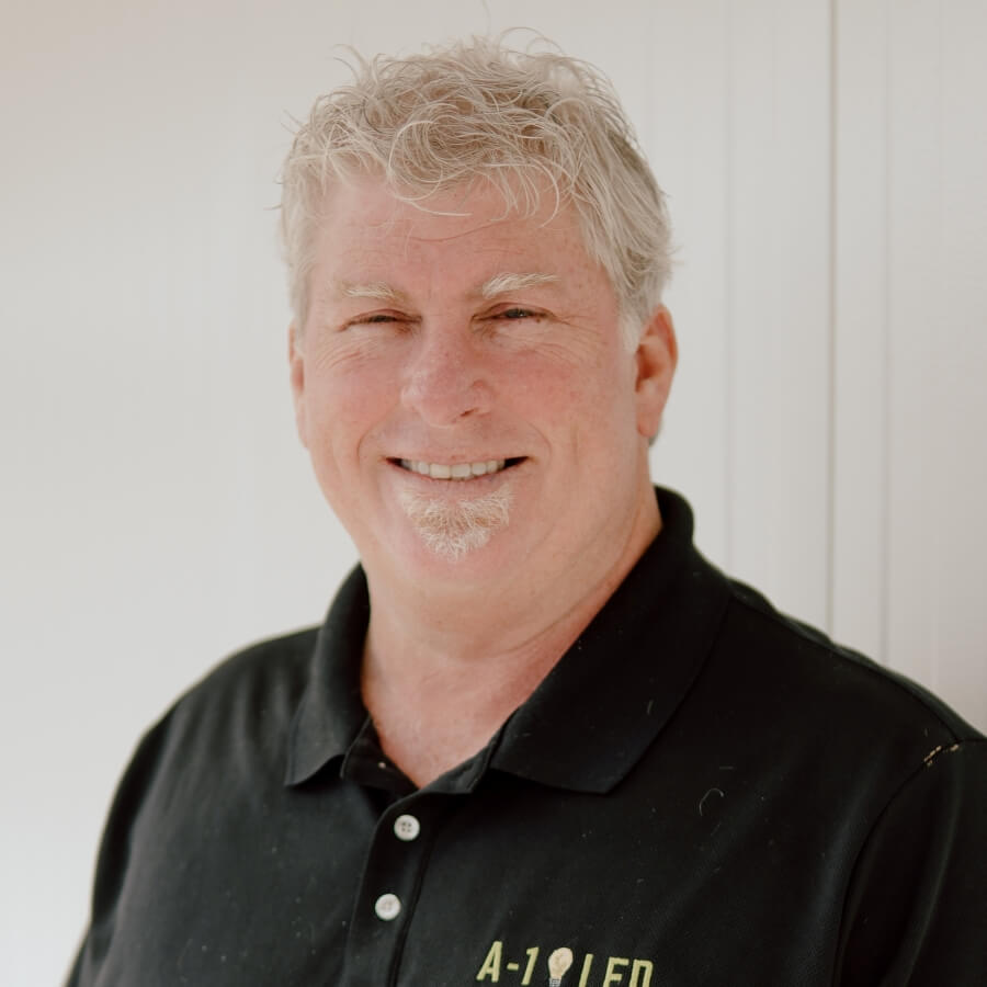 Bryan McKnight, Sales Manager at A-1 LED, beams confidently in his headshot, indicative of his expertise and enthusiasm in leading the company's sales initiatives for LED lighting solutions.
