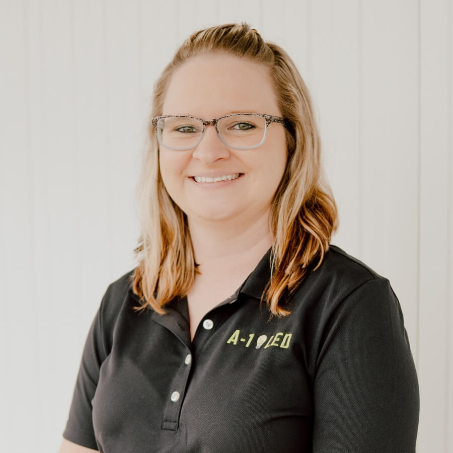 Melanie Davis, Administrative Manager at A-1 LED, in her headshot wearing a polo with the A-1 LED logo, showcases her approachable and professional demeanor.